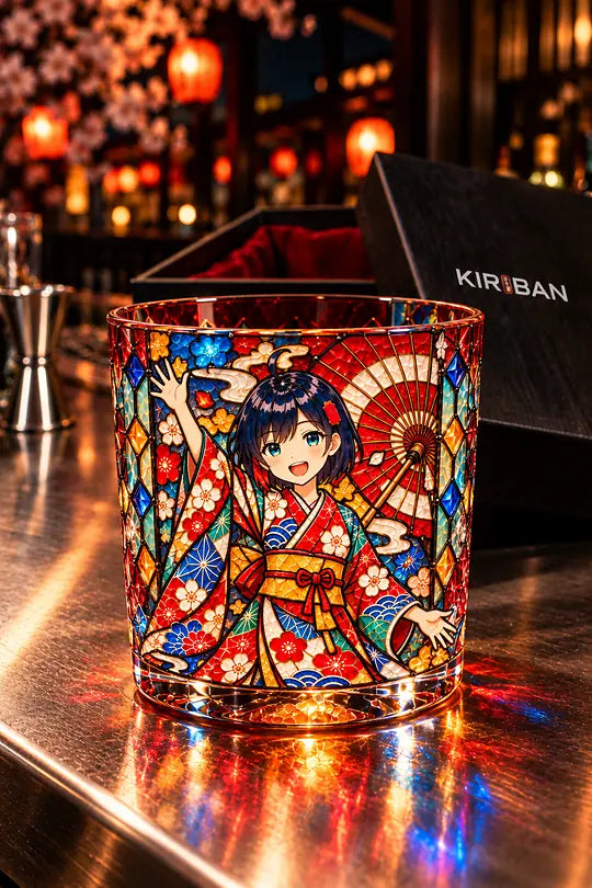 A glass tumbler printed with a stained-glass festival portrait on a steel bar counter.