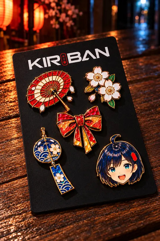 Five enamel pins on a black KIRIBAN card on a wooden table.